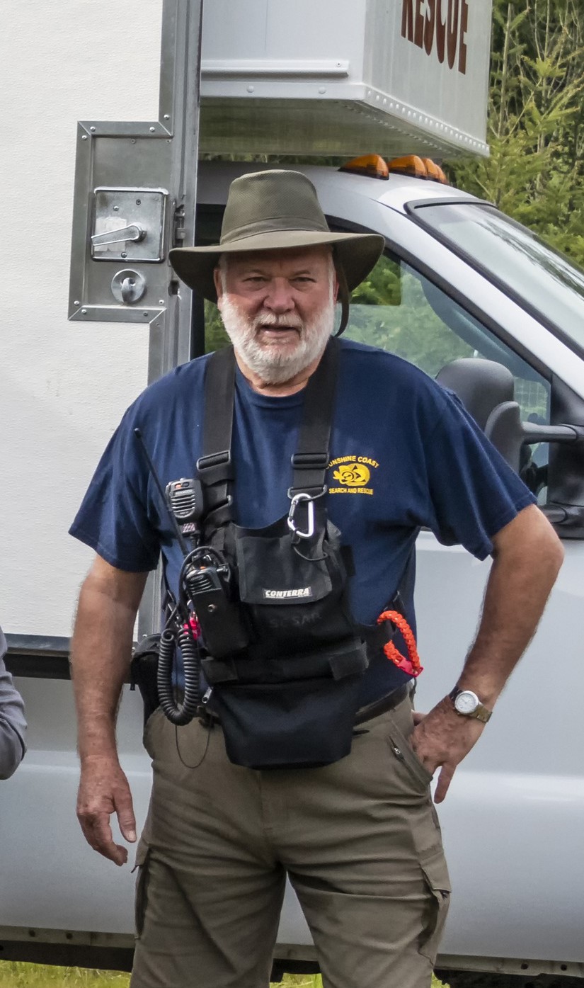 Robert Allen standing with hand on hip in his Search and Rescue gear.